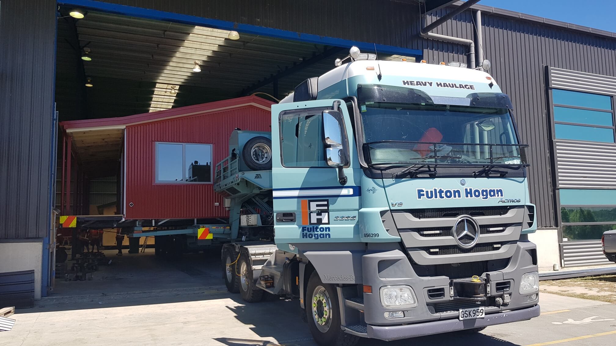 A Genius Homes prefab home being moved onsite